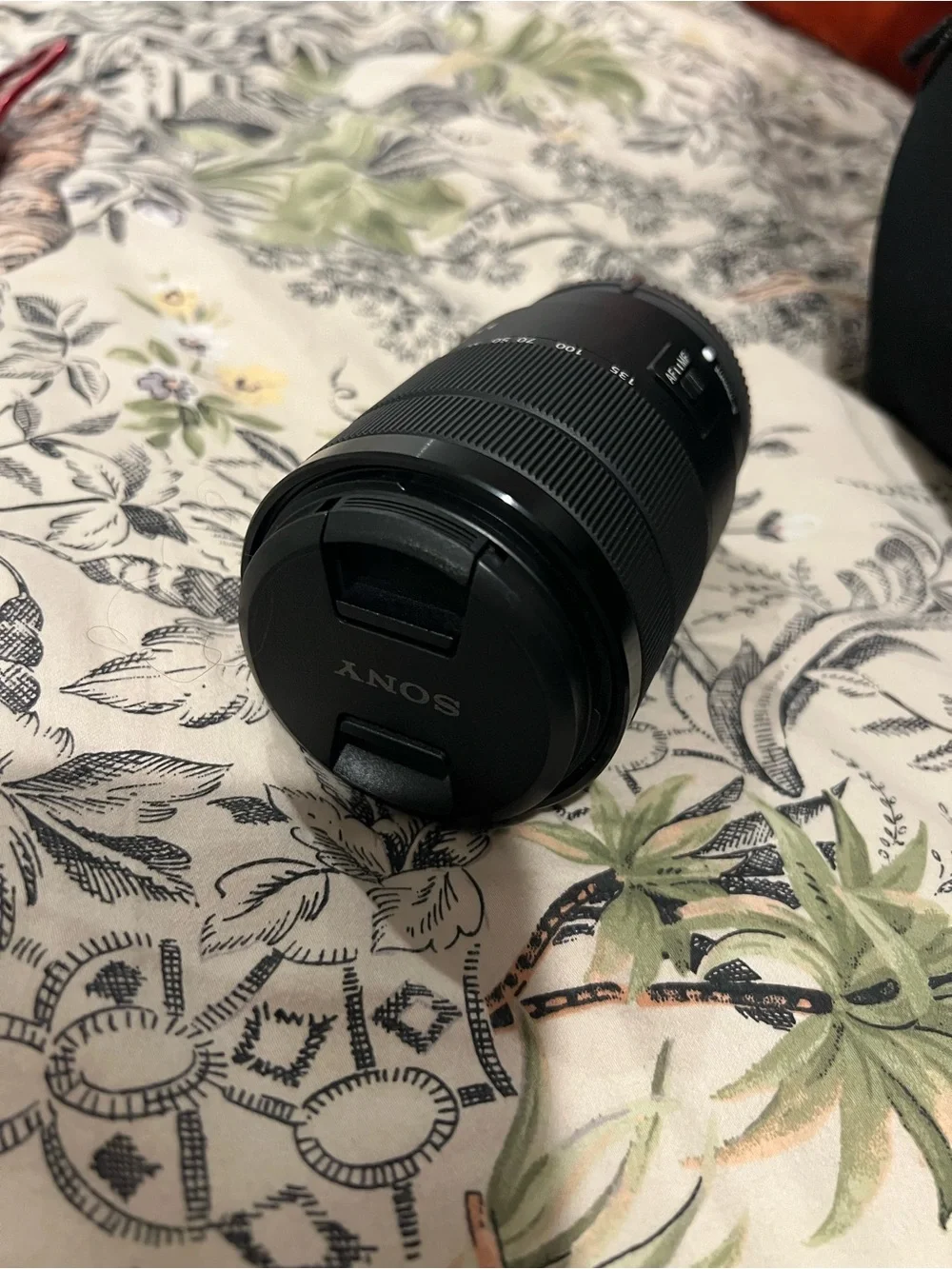 Sony Black Alpha Mirrorless A6100 Camera Body with Black Strap and Orange Accent